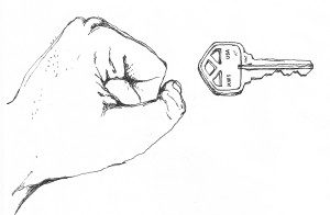 A drawing of a fist beside a key.