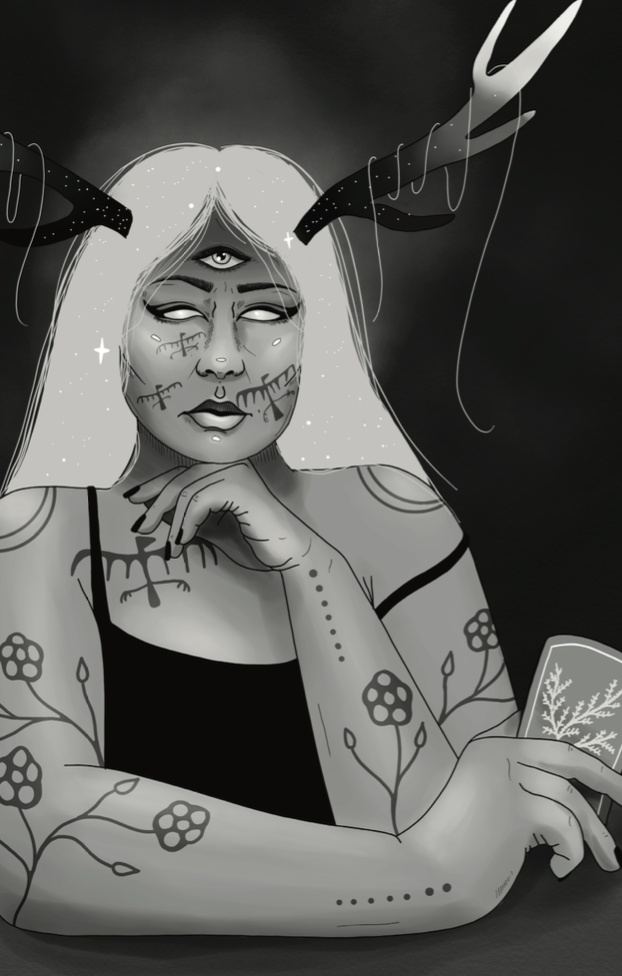A woman with antlers, tattoos, and a third eye, holds a playing card and stares with blank eyes.